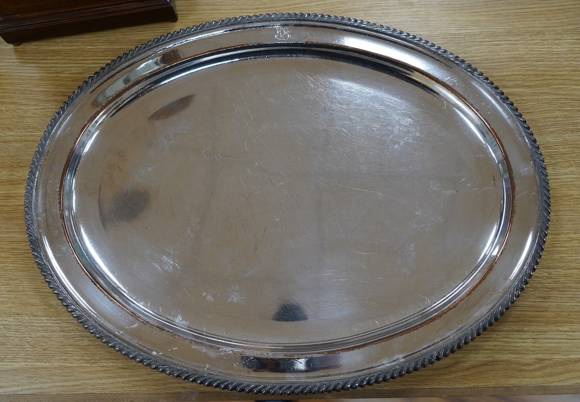 Two 19th century Old Sheffield plate oval meat plates, with gadrooned borders, largest 58.2cm. Condition - plate worn and scratched